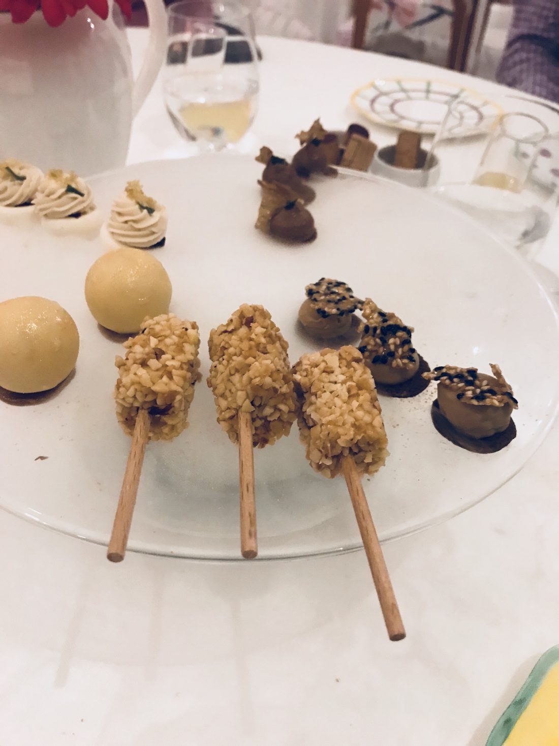 A smoke-filled platter of bite-size Italian pastries and truffles