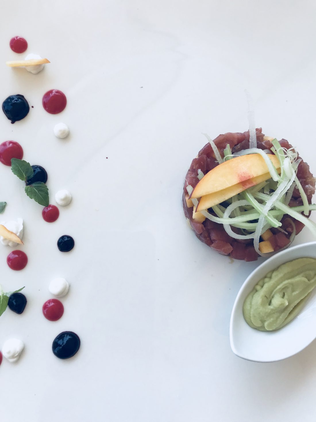 An elegantly presented peach-infused tuna tartare at the Belmond restaurant