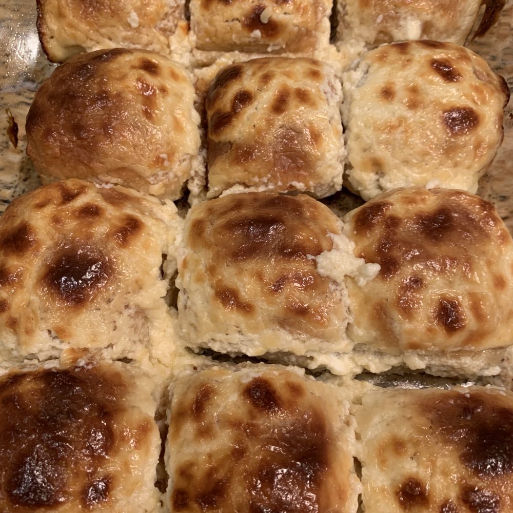 A freshly roasted dish sitting on the rustic farm table
