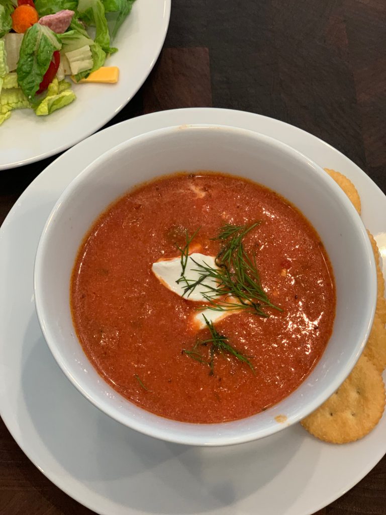Tomato Soup in Bowl with Crackers